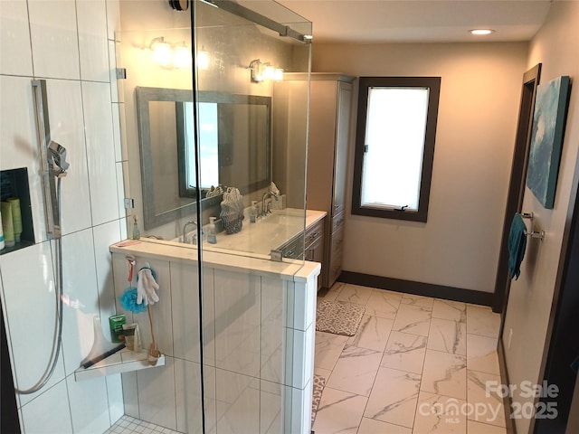 bathroom with vanity and an enclosed shower