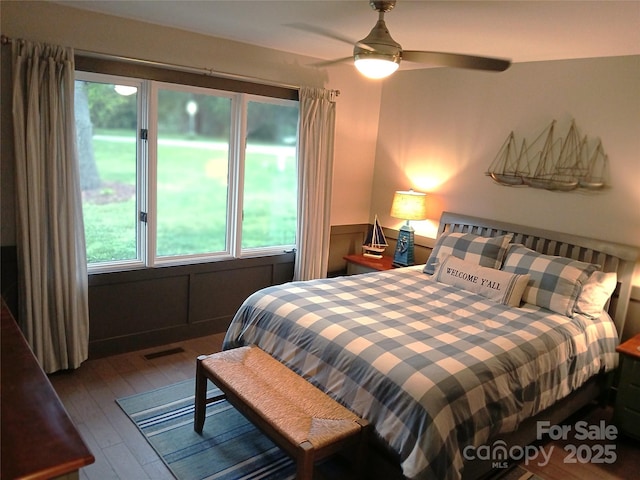 bedroom featuring hardwood / wood-style flooring and ceiling fan