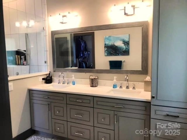 full bath with a sink and double vanity