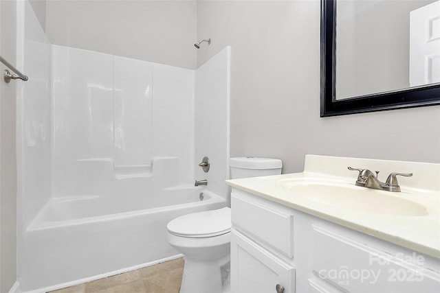 full bathroom featuring toilet, tile patterned floors, bathing tub / shower combination, and vanity