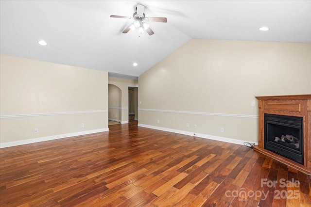 unfurnished living room featuring hardwood / wood-style flooring, ceiling fan, and lofted ceiling