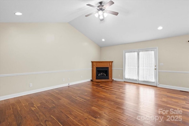 unfurnished living room with ceiling fan, vaulted ceiling, and hardwood / wood-style flooring