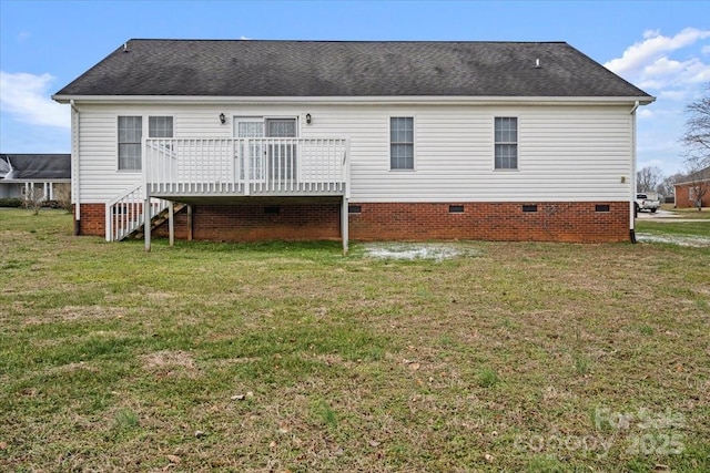 back of house with a lawn and a deck