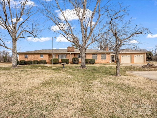 ranch-style house with a garage and a front yard