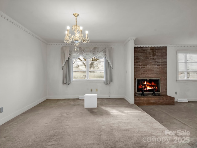 unfurnished living room with a fireplace, a chandelier, and dark carpet