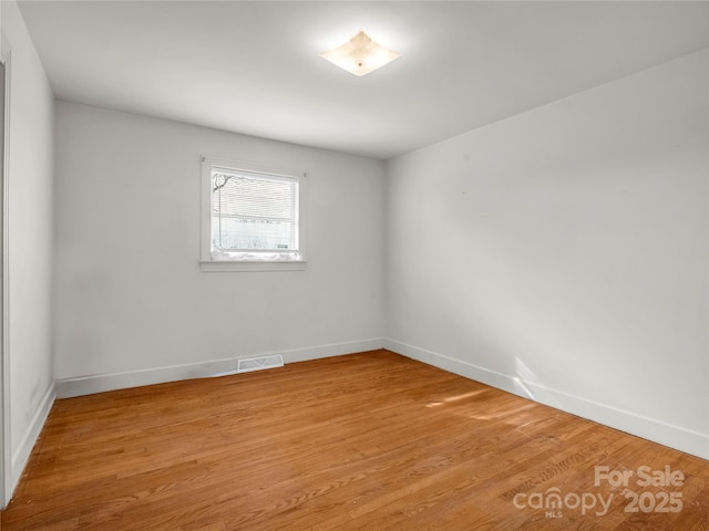 unfurnished room featuring light hardwood / wood-style flooring