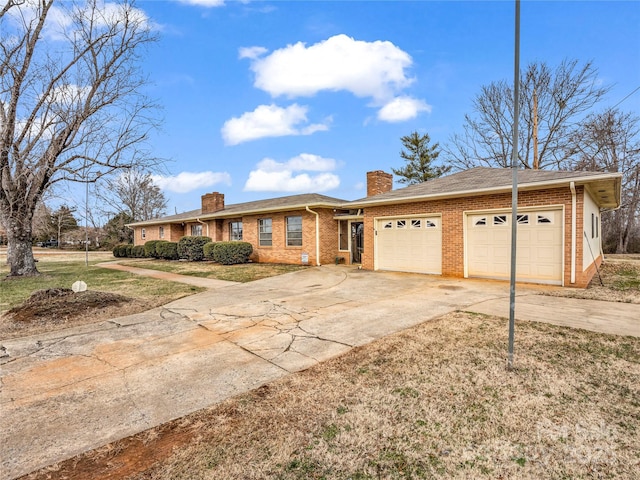 single story home featuring a garage and a front yard