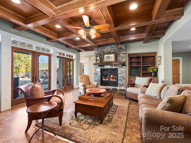 living room with beam ceiling, french doors, coffered ceiling, and wooden ceiling