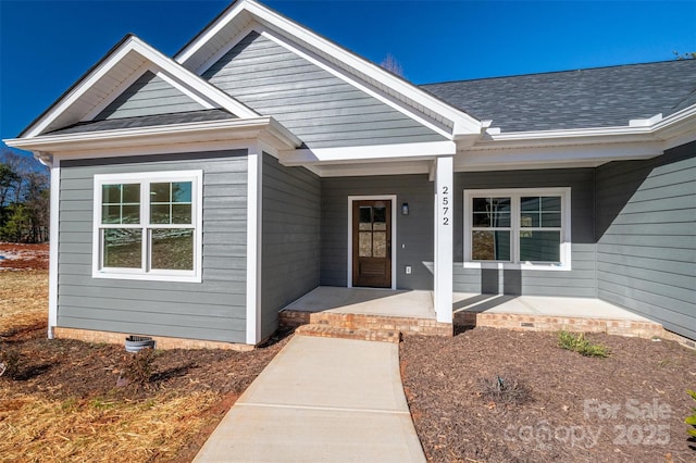 entrance to property with covered porch