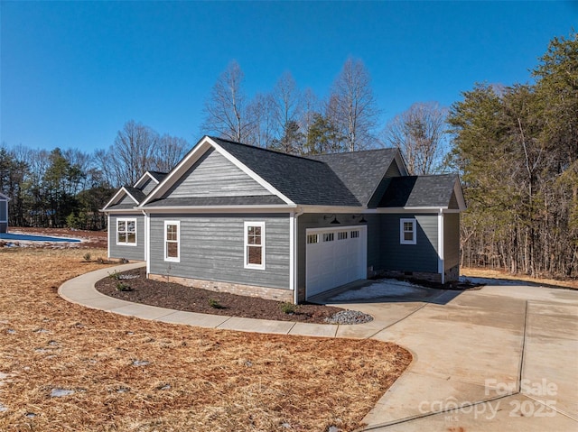 view of side of property featuring a garage