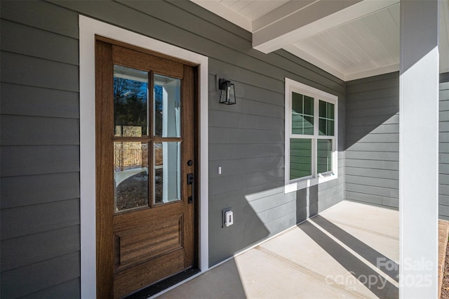 doorway to property with covered porch