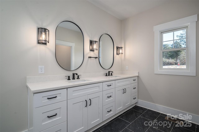 bathroom with tile patterned flooring and vanity