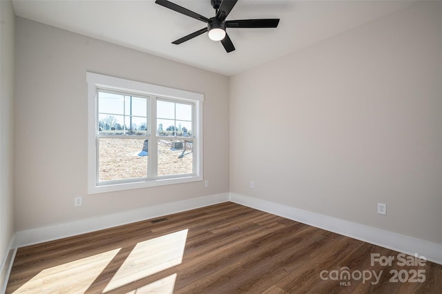 empty room featuring ceiling fan and wood-type flooring