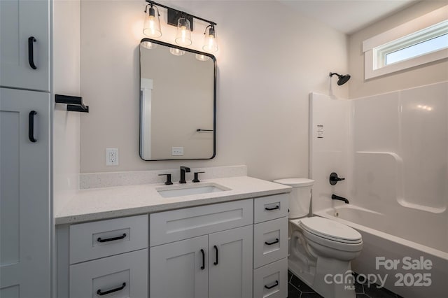 full bathroom with shower / washtub combination, vanity, and toilet