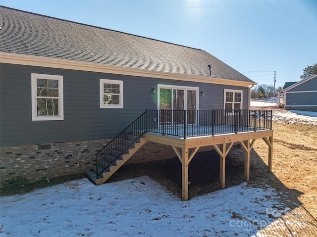 back of house featuring a deck