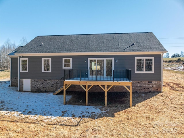 back of house with a deck