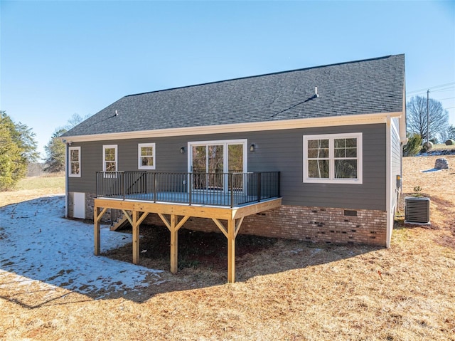 back of house with a deck and central AC unit