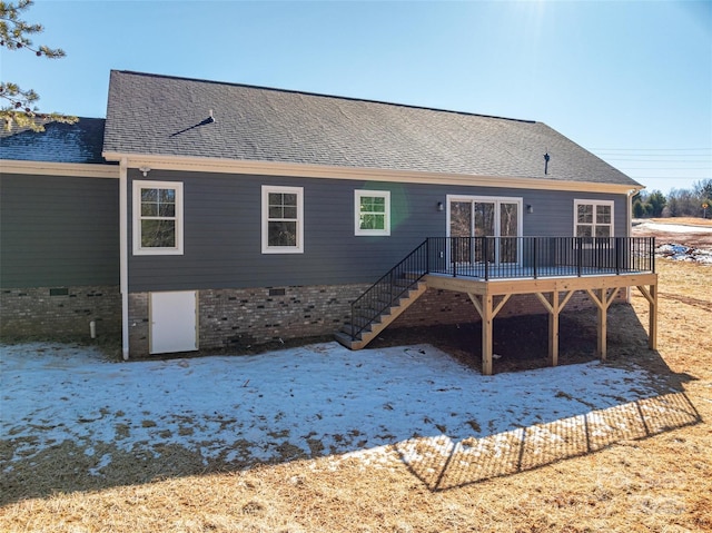 back of house with a wooden deck