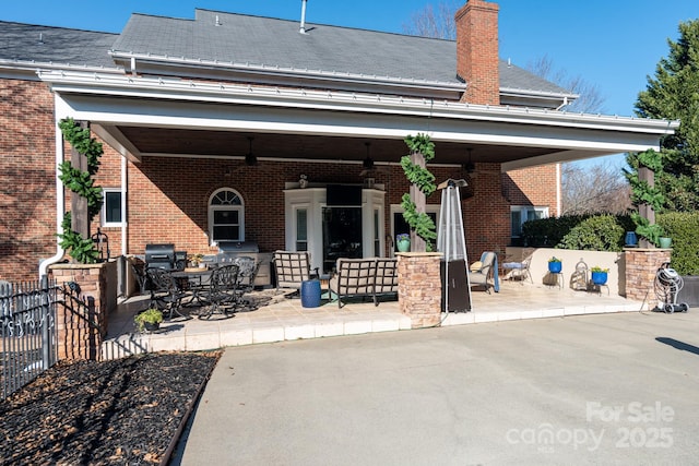 rear view of house featuring a patio area