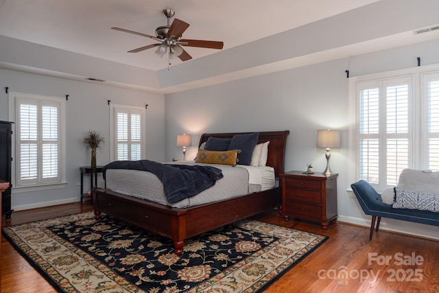 bedroom with hardwood / wood-style floors and ceiling fan