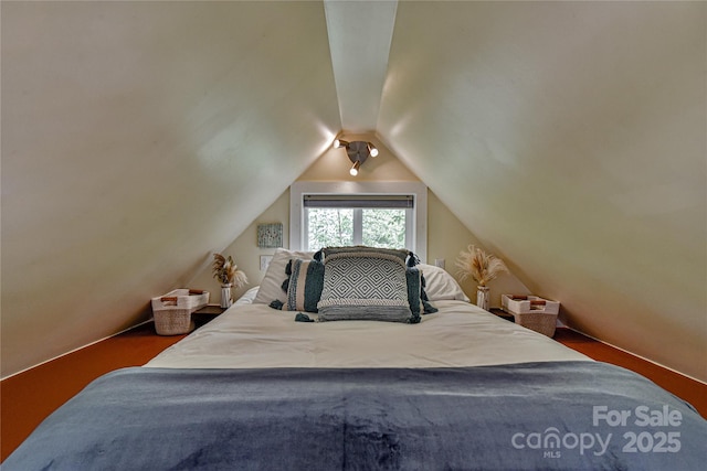 bedroom with lofted ceiling
