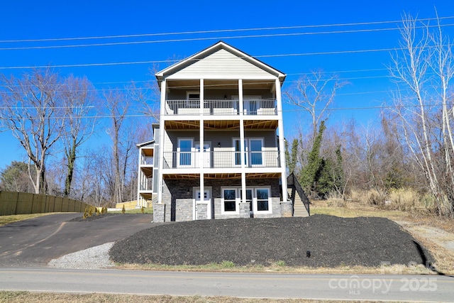 view of front of house with a balcony