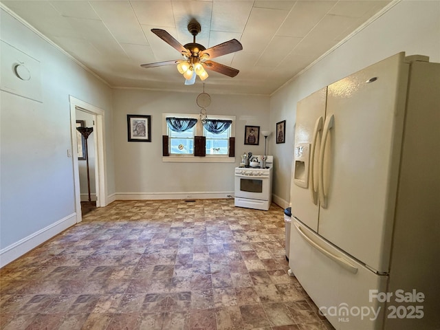 kitchen featuring ceiling fan, crown molding, and white appliances