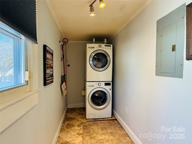 laundry room featuring electric panel, stacked washer / dryer, and ornamental molding