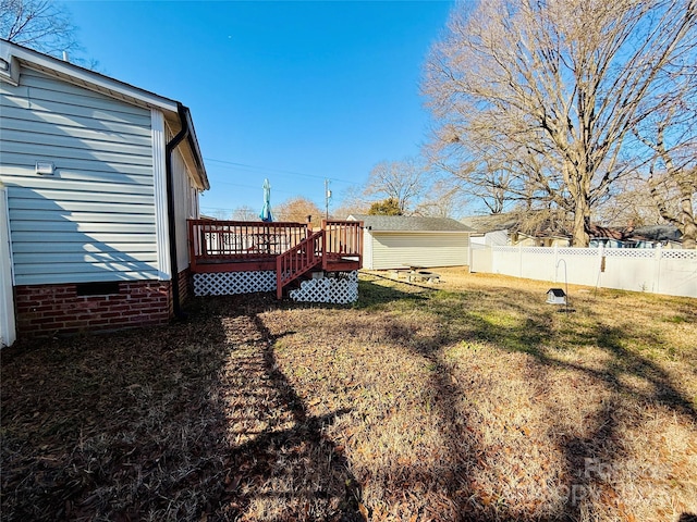 view of yard with a wooden deck