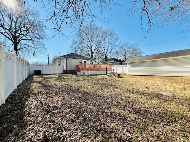 view of yard featuring a wooden deck