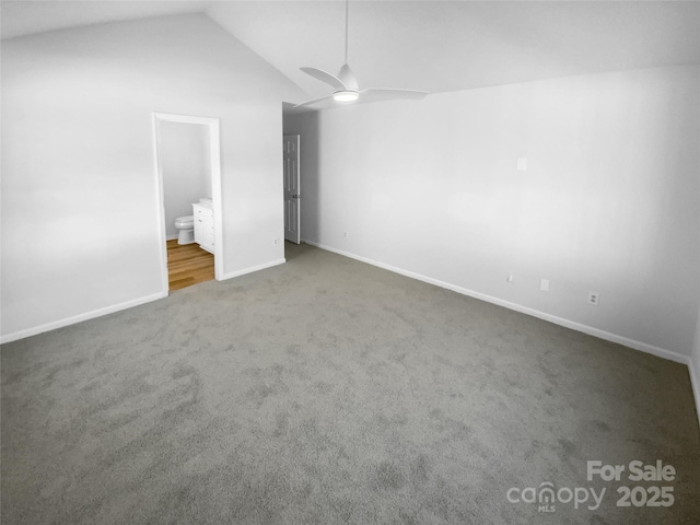 unfurnished bedroom with ceiling fan, lofted ceiling, carpet floors, and ensuite bath