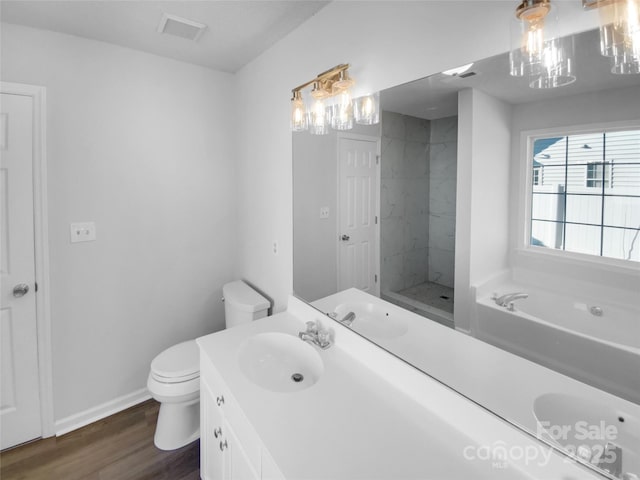 full bathroom with separate shower and tub, vanity, wood-type flooring, and toilet