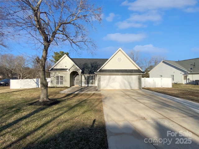 view of front of property with a front yard and a garage