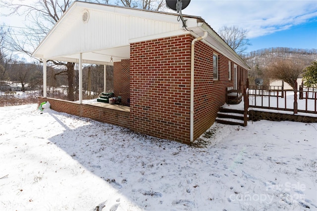 view of snow covered property