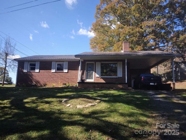 ranch-style home with a front lawn and a carport