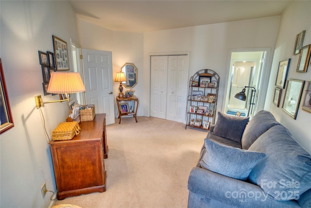 living room featuring light carpet