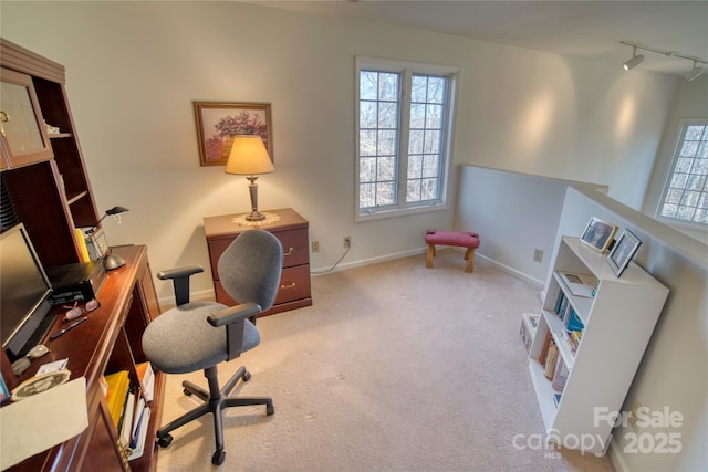 office featuring carpet and track lighting