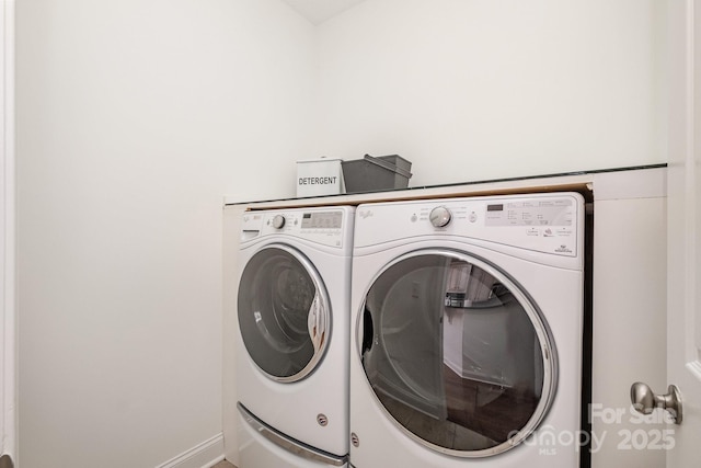 laundry room with washer and clothes dryer