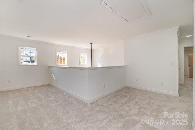 carpeted spare room featuring ornamental molding