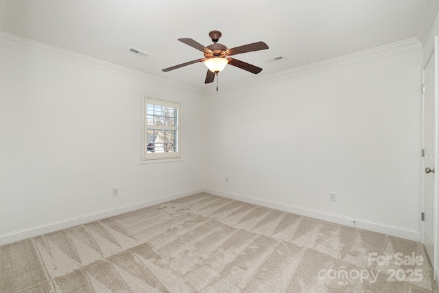 spare room with light carpet, ceiling fan, and ornamental molding