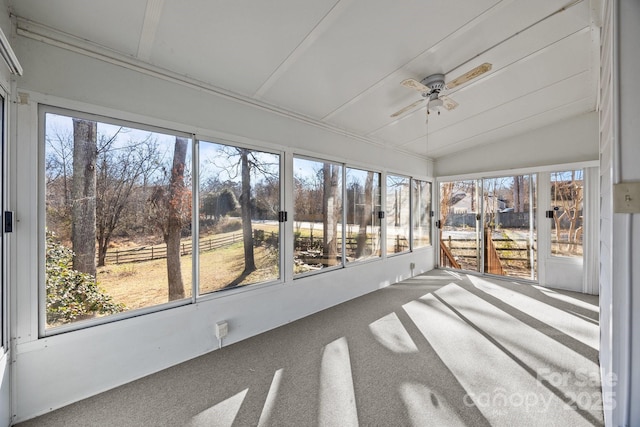 unfurnished sunroom featuring ceiling fan and lofted ceiling