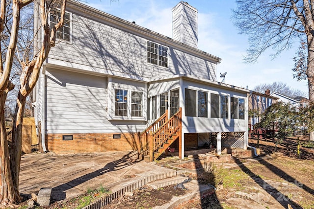 back of house with a sunroom