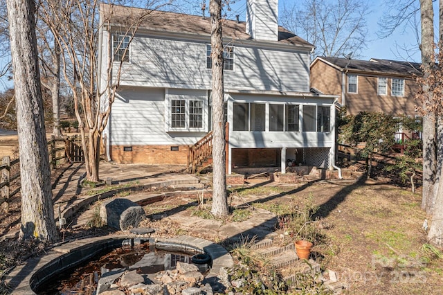 rear view of house with a sunroom