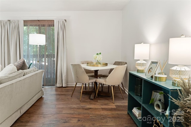 dining area featuring dark hardwood / wood-style floors