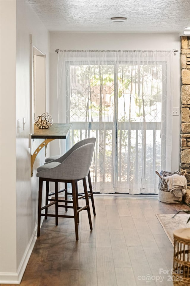 dining area with a textured ceiling