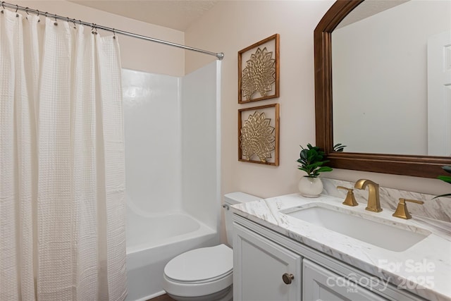 full bathroom with shower / tub combo with curtain, vanity, and toilet