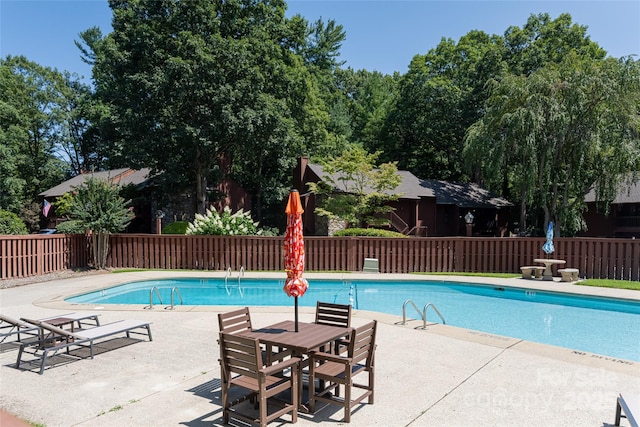 view of swimming pool featuring a patio