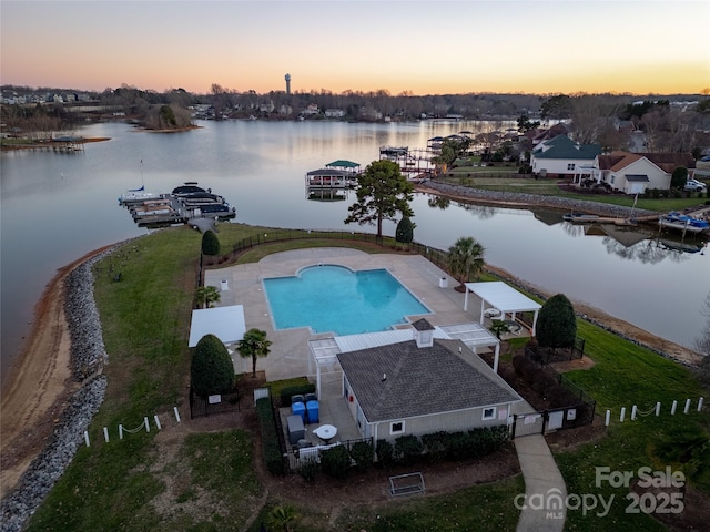 aerial view at dusk with a water view