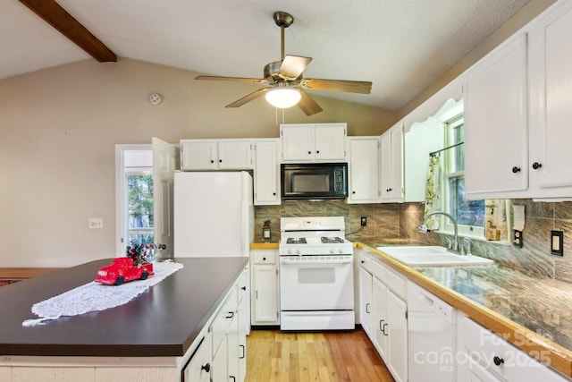 kitchen featuring white appliances, white cabinets, decorative backsplash, and sink