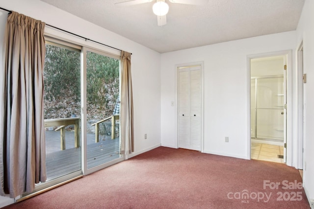 unfurnished bedroom featuring connected bathroom, a closet, ceiling fan, carpet flooring, and access to exterior